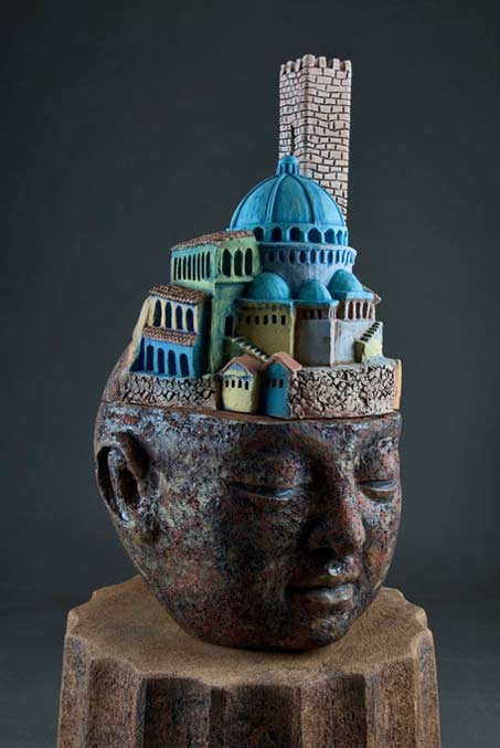 clayton_thiel_bigHeads_Memory clayton_thiel_bigHeads_Memory Sculpture of a head with arched buildings on top