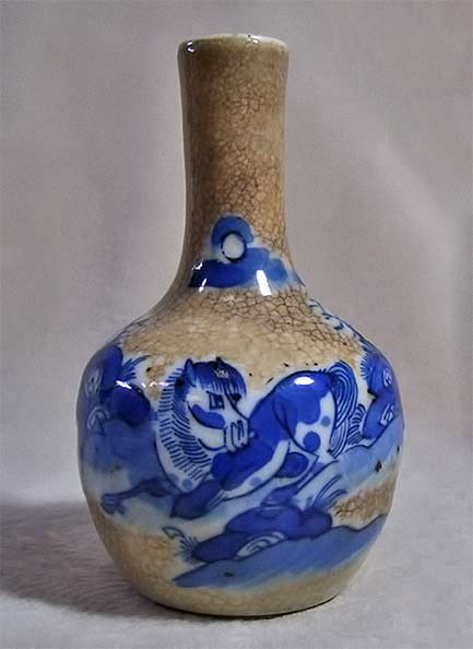 Chinese antique vase with horse motif in blue and white