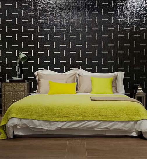 Casamood Vetro Decoro Stripes wall tiles and lemon yellow bed