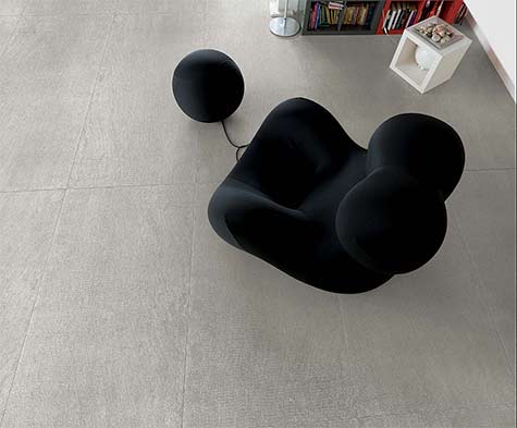 Casamood--textured-floor-tiles and black modern biomorphic chair