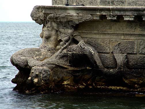 Winged mermaid at the stern of the stone barge at Vizcaya Mansion. Photo by seekingmuse