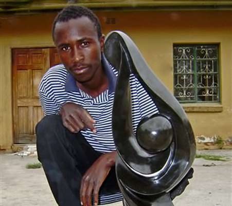 shona-artist with his sculptor-in-Zimbabwe