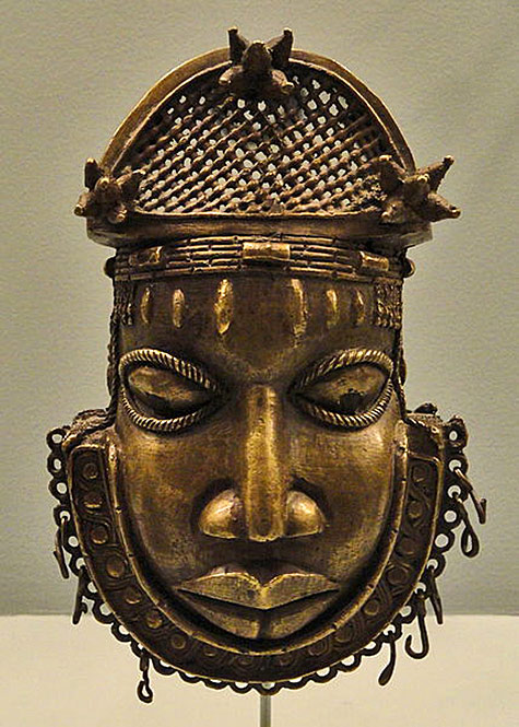 African Hip ornament representing the head of a Benin court official-early 18th century, brass and iron