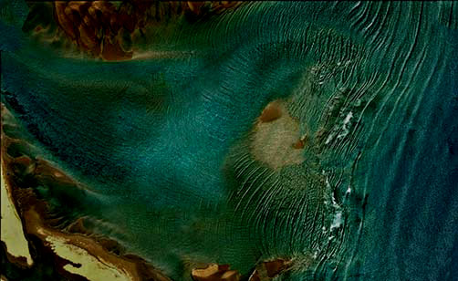 Inverloch-Mermaid-swimming in jade waters