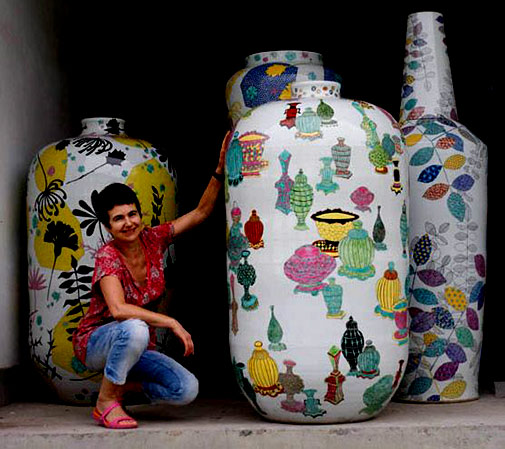 Felicity Aylieff posing with her monumental ceramic pots
