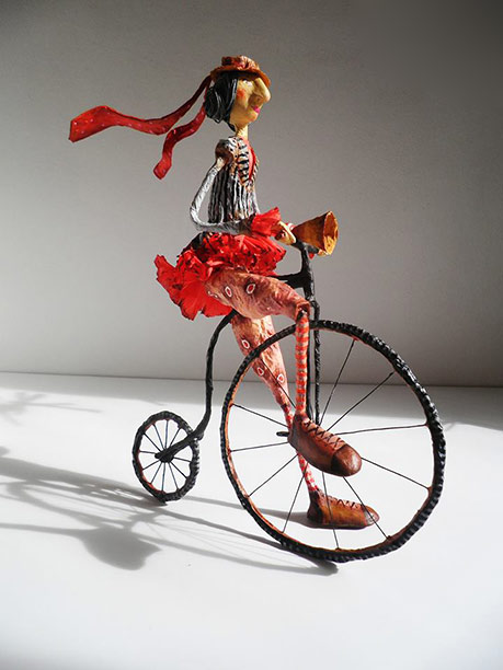 Girl riding penny farthing bike - Natalia Mendoza