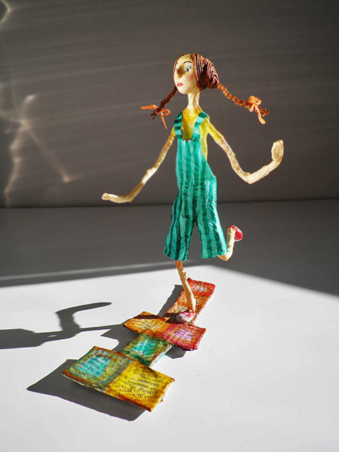 Natalia Mendoza girl in green dress hopscotch figure