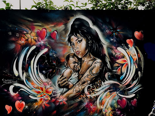 Hackney-Road-Street-Art- tattooed girl holding baby