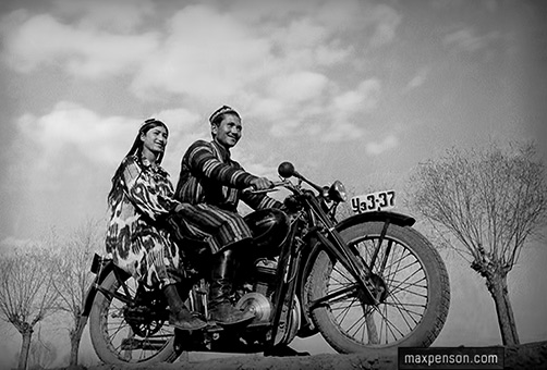 A young man and a girl on a motorcycle - Max Penson