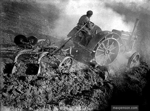 In field--Max Penson Soviet tractor ploughing field