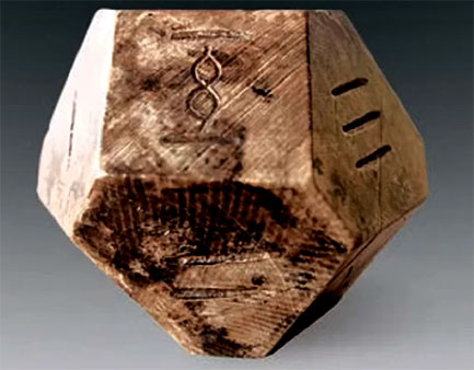 Caved stone dice for ancient game called Bo