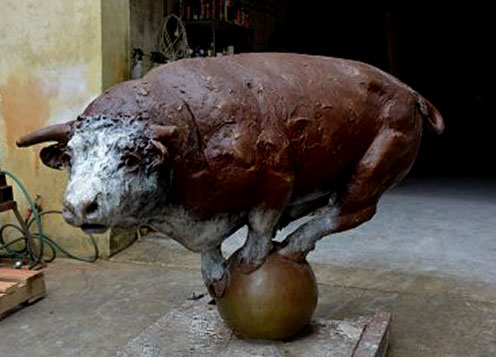 Darien Pullen -- bull standing on globe sculpture