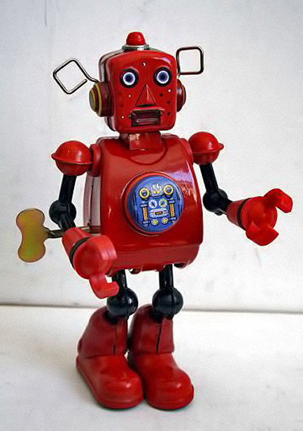 Vintage red wind-up robot with startled face