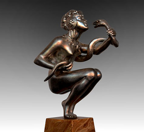 Female holding-serpent sculpture - )Signed Isdrebrad