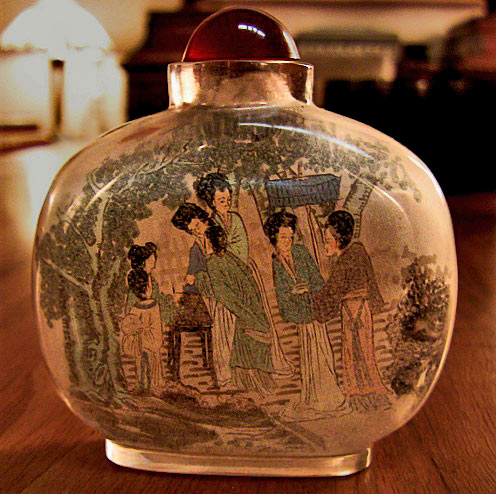 Chinese Inside painted glass snuff bottle with ladies in a garden