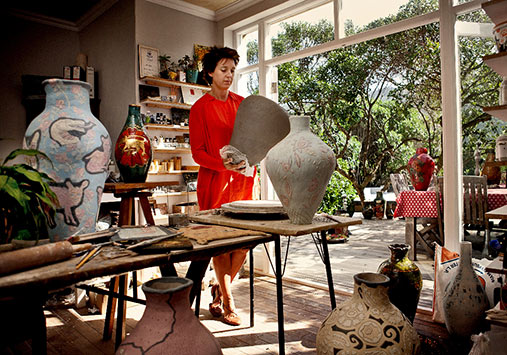 Lucinda-Mudge-in-South-African-studio with her pottery