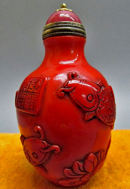 Deep Red Peking Glass Carved Snuff Bottle - Fish & Lotus