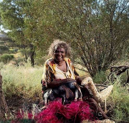 Tjanpi artist Niningka Lewis from Pukatja SA, who has been selected as a finalist in the National Aboriginal and Torres Strait Islander Art AwardsImage by Rhett Hammerton.