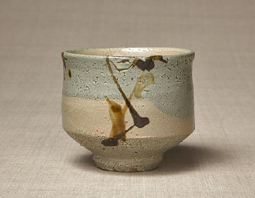 Tea bowl with sugarcane design in black iron glaze. 1955. by Shoji Hamada. Mashiko, Japan