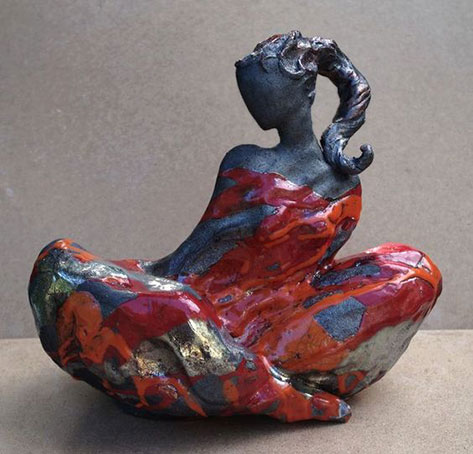 Claude Cavin - seated woman sculpture