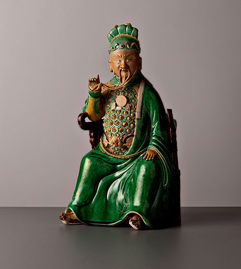 A-figure-of-the-Daoist God of War,-Guandi,-seated-in-a-semi-circular-chair