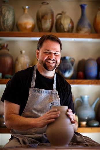 Ben Owen throwing clay