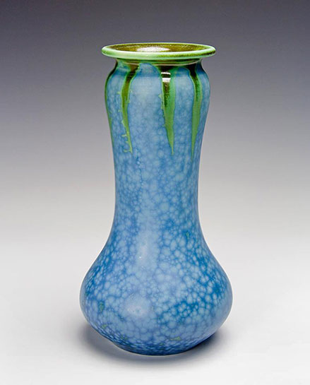 Blue hue of this matte crystalline glaze and its emerald rim