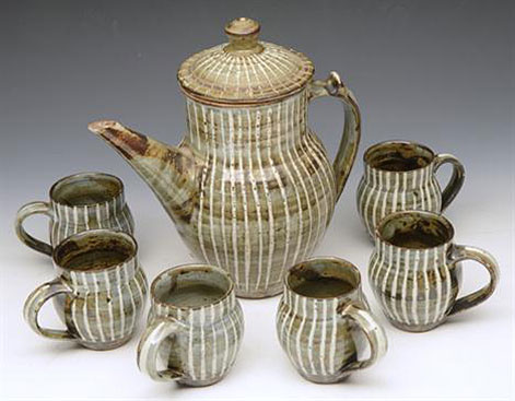 Rupert Spira--stoneware coffee pot and set of six cups, white linear glaze decoration,