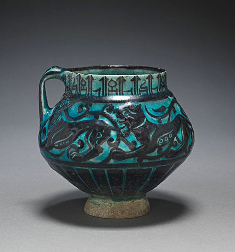 Iran, probably Kashan, Seljuk Period, 12th-13th Century, fritware with design in carved and underglaze-painted slip