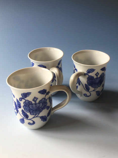 Three porcelain cups in blue and white by Alistair Whyte