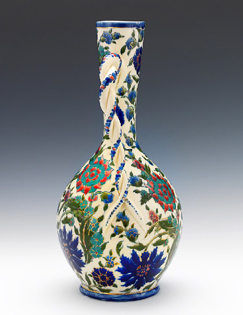 Porcelain vase with long tapered neck and intertwined, twisted handle, raised on circular foot. 