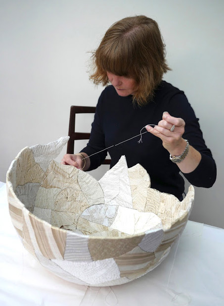 Zoe Hillyard sewing a patchwork ceramic bowl
