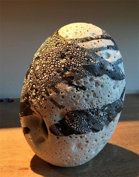 Ovoid ceramic sculpture with volcanic glaze