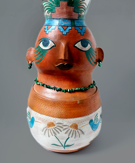Akbal Morena Pez figure-vase with floral decor