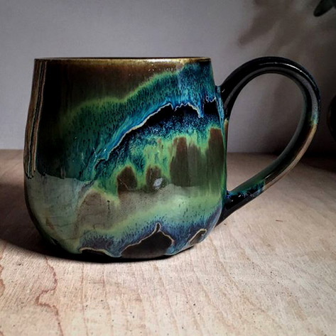 Wanita--Malas-green ceramic mug