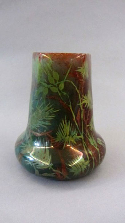 Ceramic vase with ovoid base and polygonal neck. Decoration covering ears of wheat. Covered enamel and iridescent green-meadow, green-turquoise and red. Signed Delphin Massier Vallauris