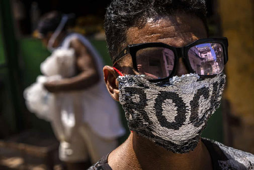 Cuban youth-wearing homemade sequinned mask
