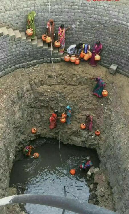 women hauling water