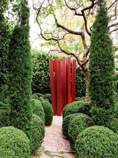 The monumental steel sculpture The Red Forest, by Shapiro, consist of seven 15- to 18-foot tall steel columns
