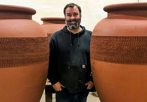 Andrew Beckham with his terracotta Novum fermentation and aging vessel