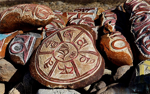 prayer stones carved with sacred symbols