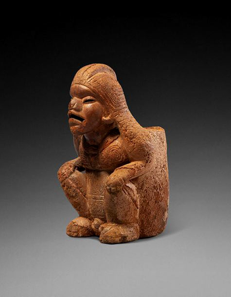 seated chief wearing a necklace with amulet. Her face wears an intense and wrathful expression. Beige and orange terracotta, micro cracks. Calima, Colombia, formative period, 200 - 700 AD