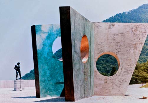 Barbara-Hepworth's-Three-Obliques-(Walk-In)-1968-installed-beside-Aristide-Maillol’s-Action-in-Chains-1906-at-Hakone-Open-Air-Museum,-1970