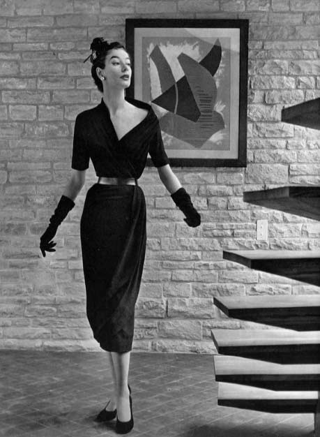 Model in black jersey dress by Mad Carpentier, photo by Pottier, 1953